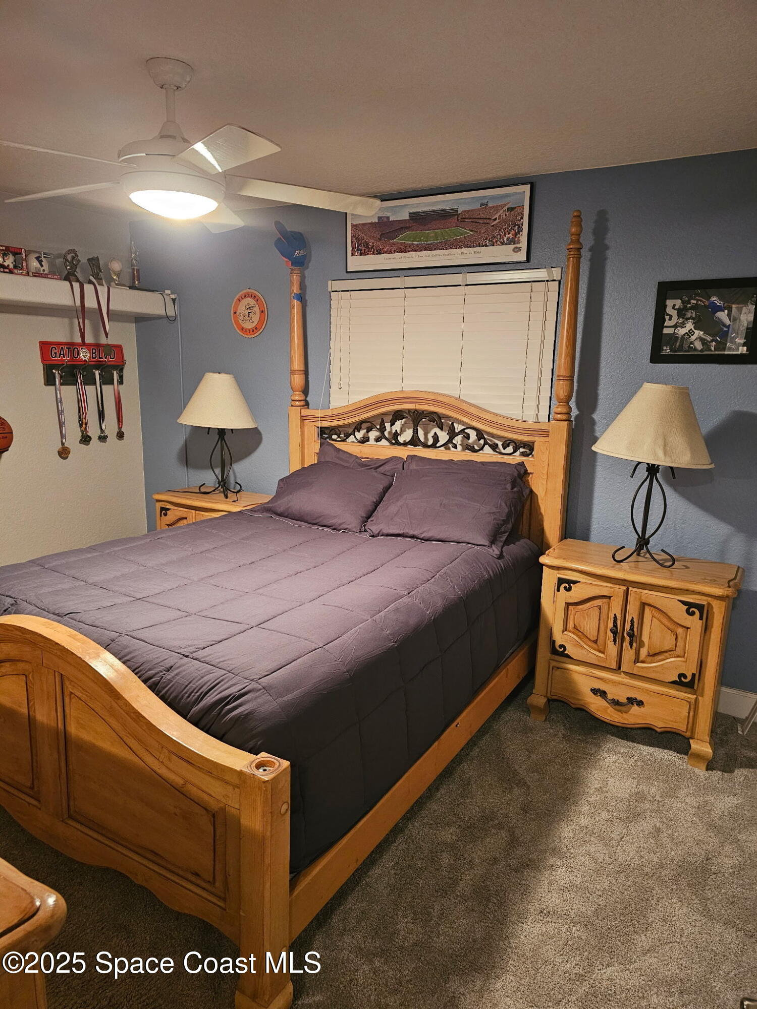 3094 Green Turtle Circle Mims, FL 32754 - Photo 45 of 63 a bedroom with a bed and lamp