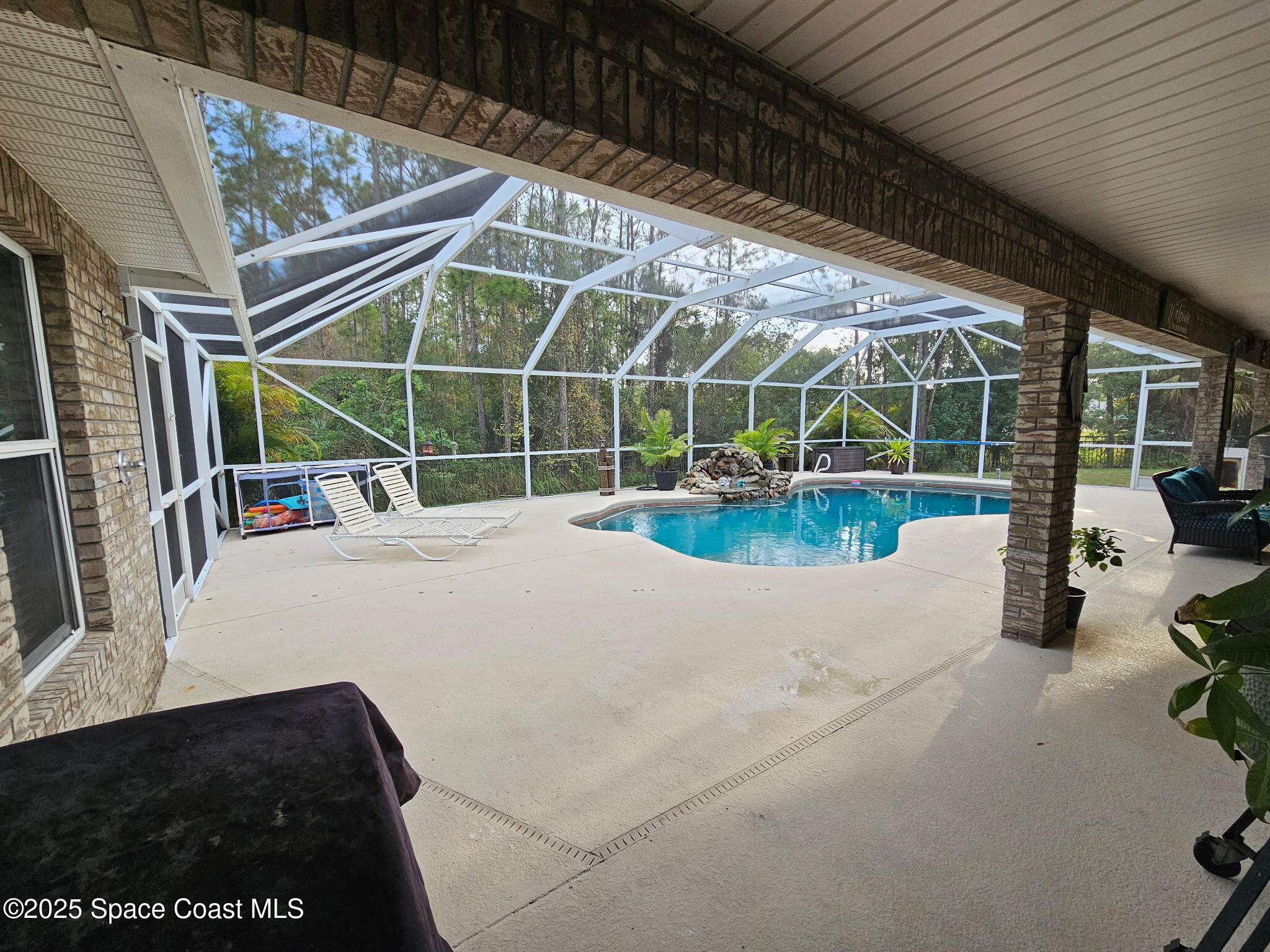 3094 Green Turtle Circle Mims, FL 32754 - Photo 50 of 63 a view of a roof deck with couches and potted plants