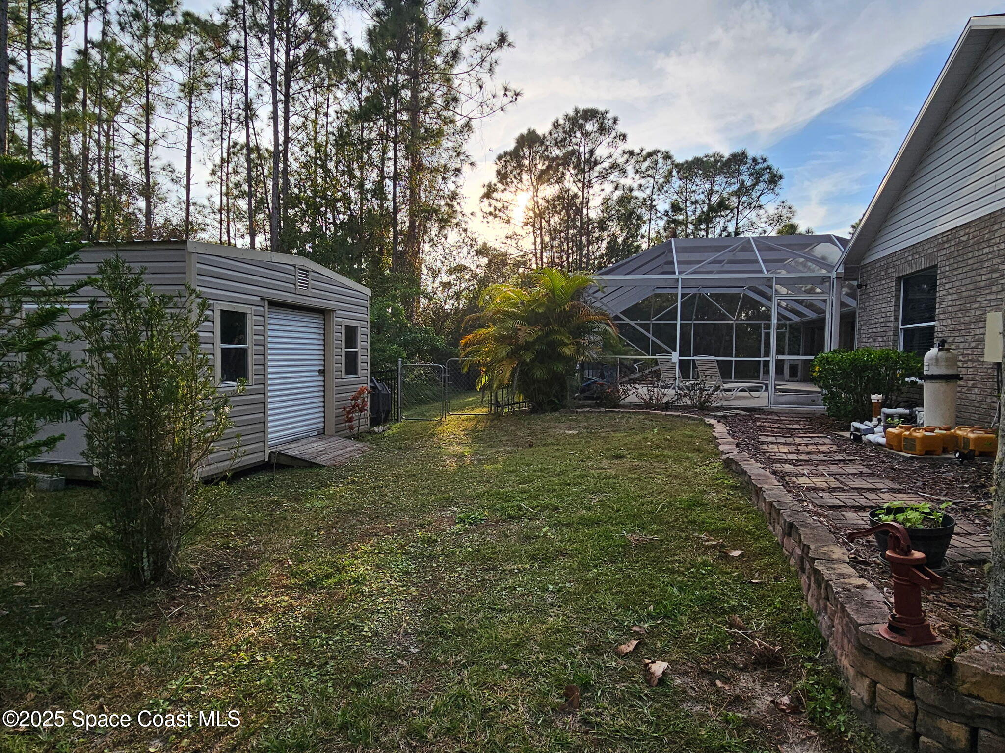 3094 Green Turtle Circle Mims, FL 32754 - Photo 63 of 63 a view of a backyard with plants and a garden