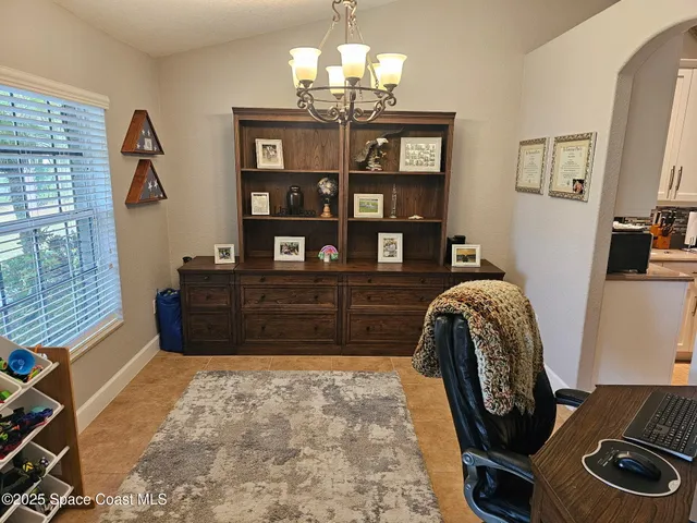 a living room with fireplace furniture and a flat screen tv