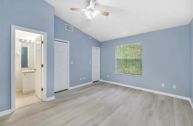 a view of an empty room with a window