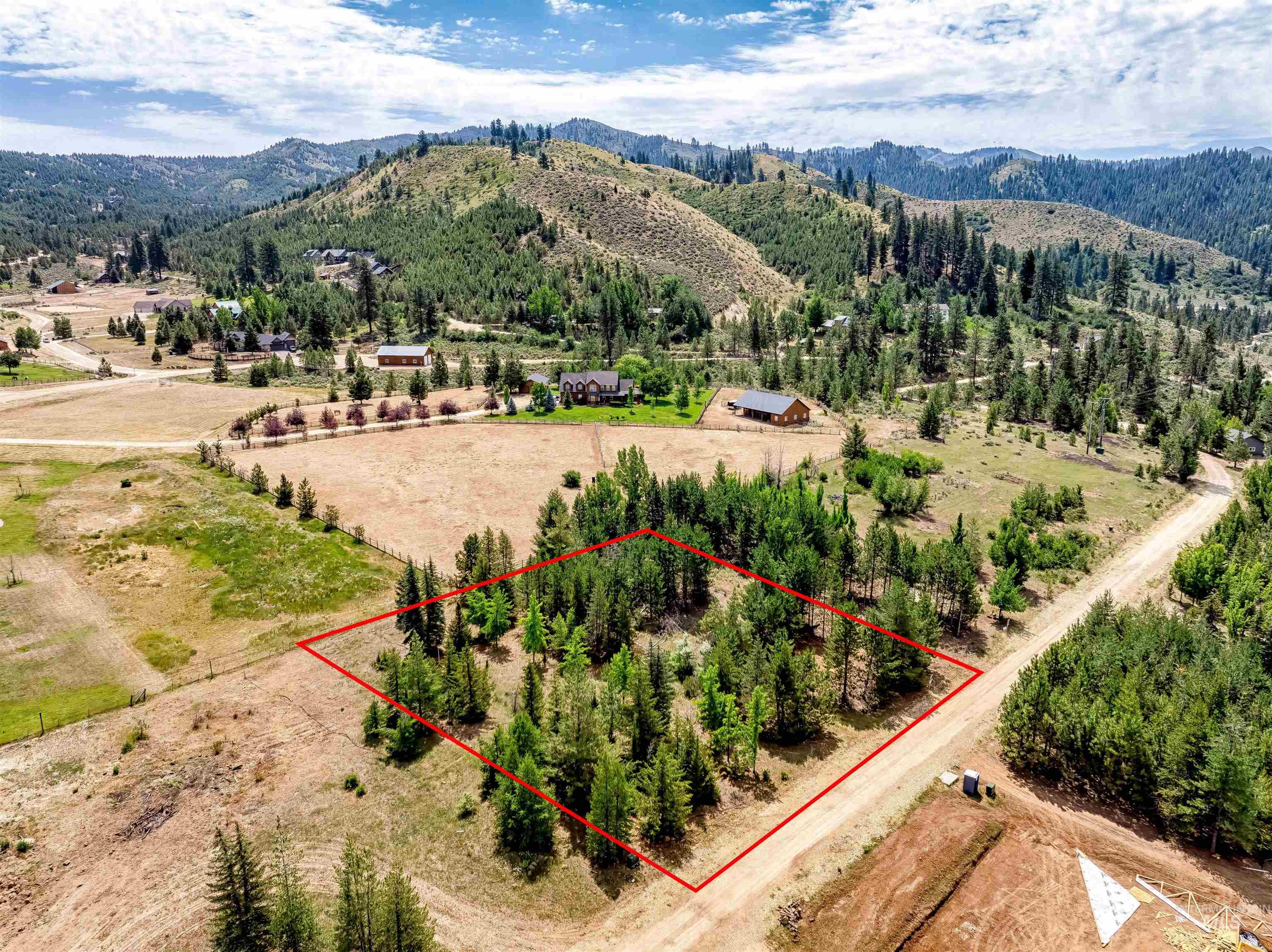 Lot 15 North Corral Flat Road Boise, ID 83716 - Photo 4 of 27 Aerial view of property and surrounding area featuring a mountain backdrop and property boundaries highlighted