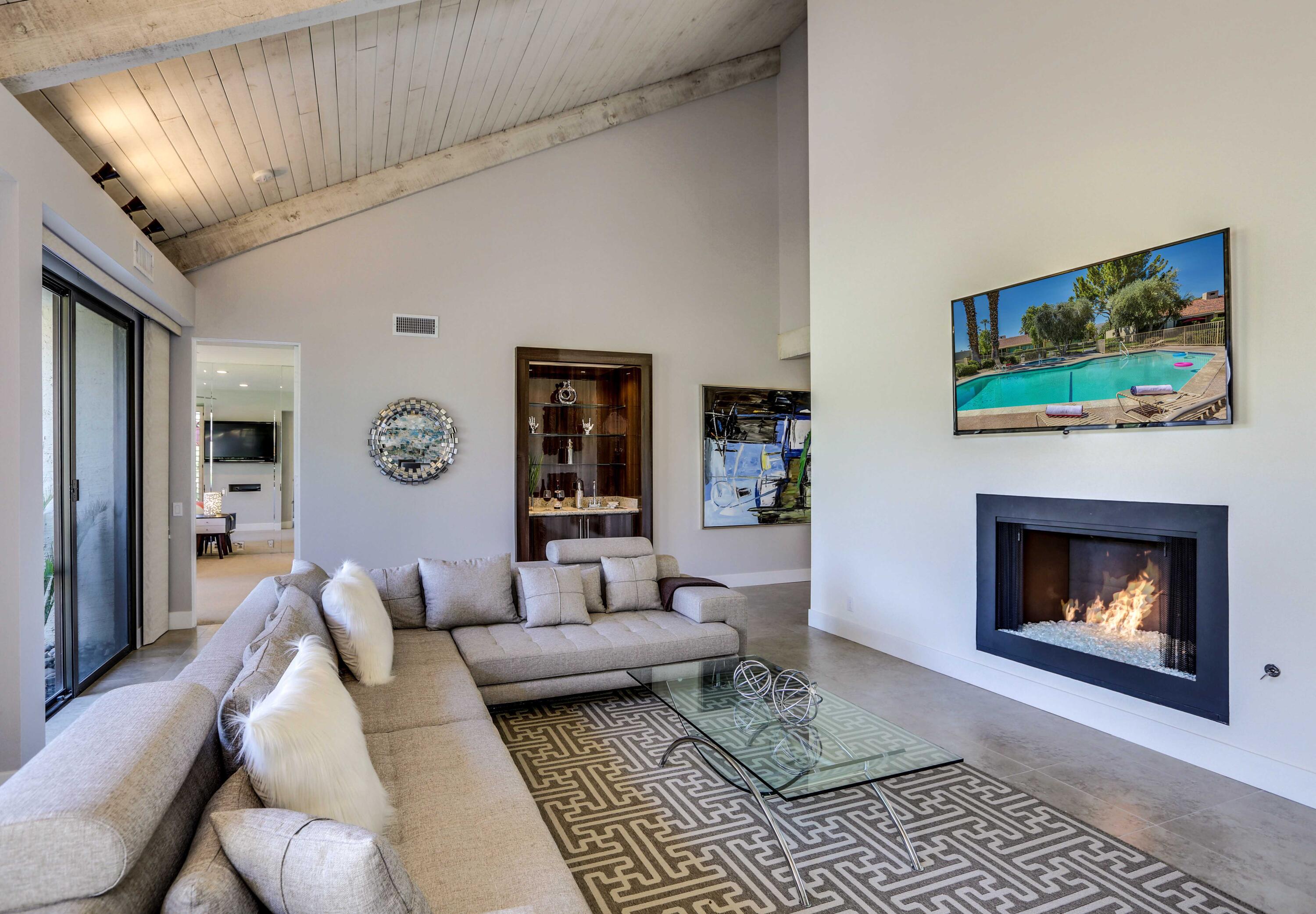 136 Desert W Drive Rancho Mirage, CA 92270 - Photo 11 of 46 a living room with furniture and a fireplace