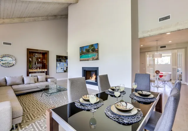 a living room with furniture and a table