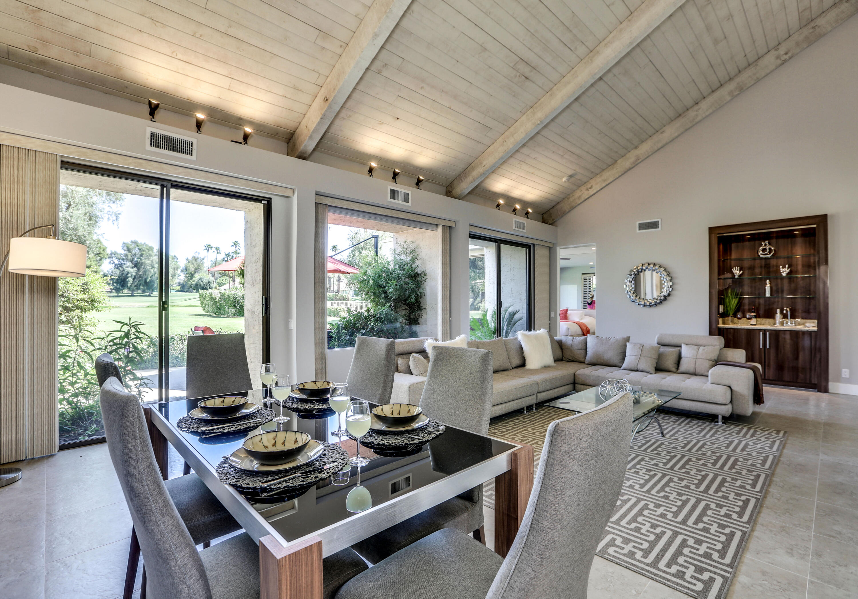 136 Desert W Drive Rancho Mirage, CA 92270 - Photo 15 of 46 a living room with furniture and a large window