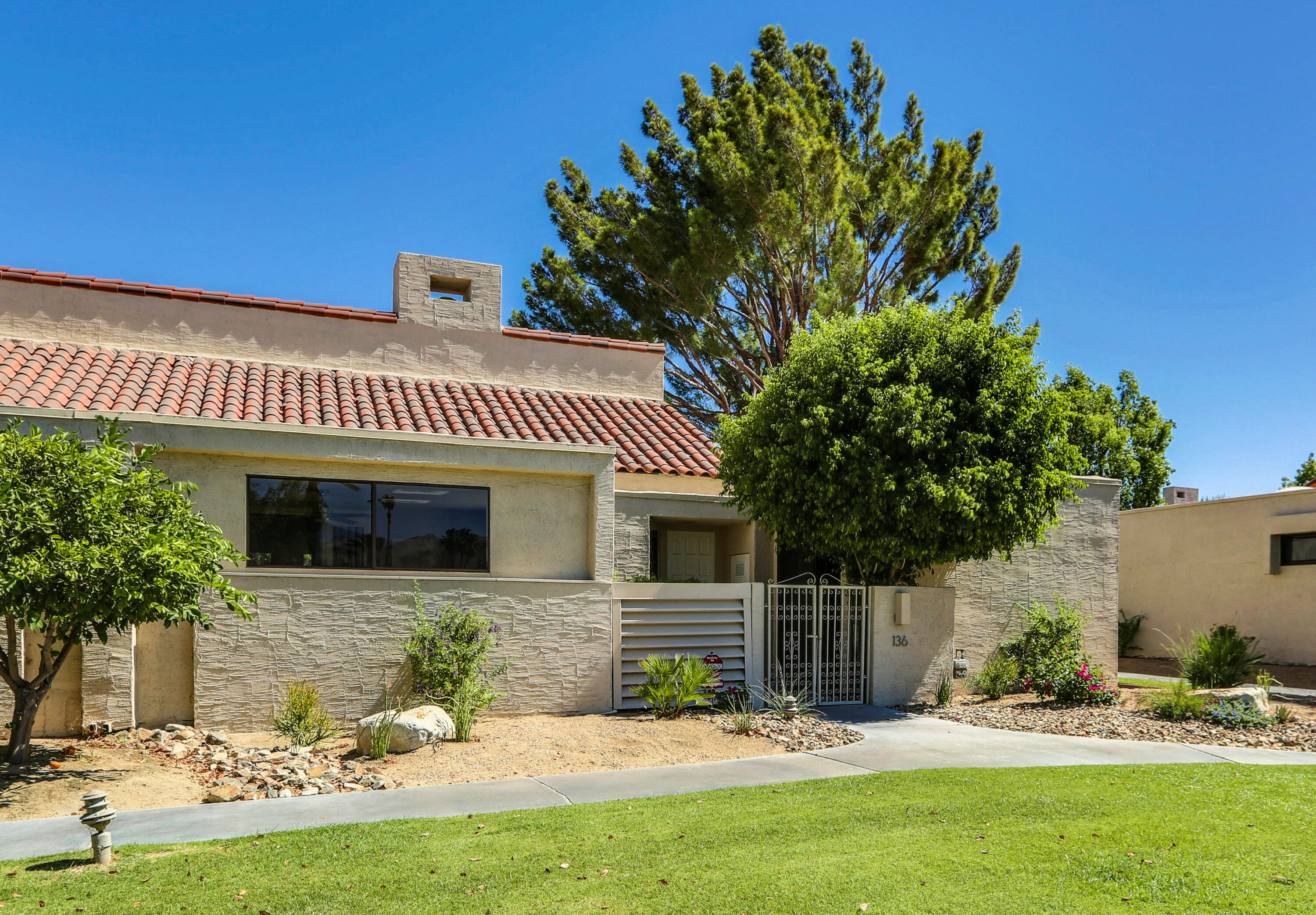 136 Desert W Drive Rancho Mirage, CA 92270 - Photo 2 of 46 a view of a house with a yard