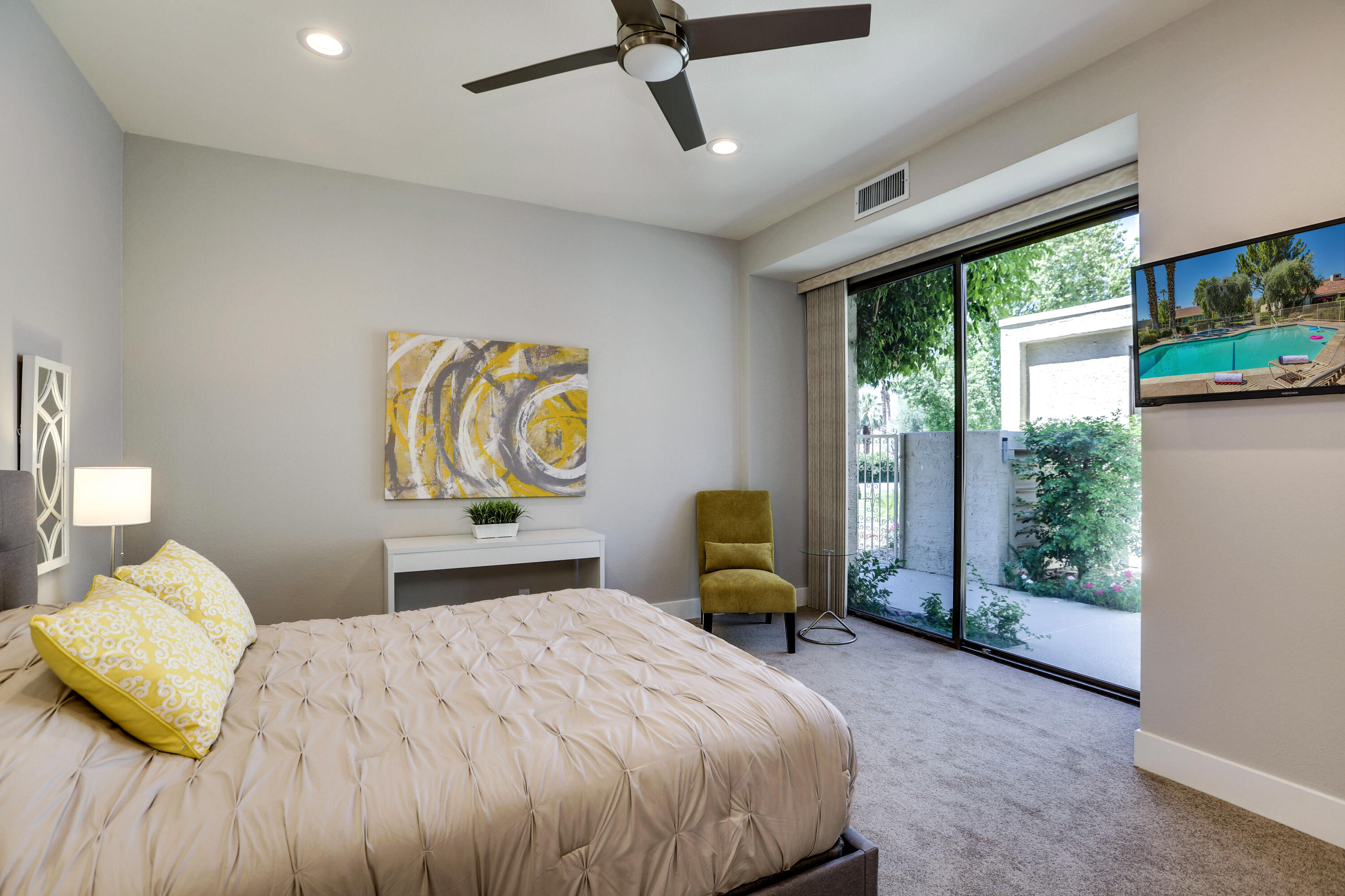 136 Desert W Drive Rancho Mirage, CA 92270 - Photo 25 of 46 a bedroom with a bed mirror and window