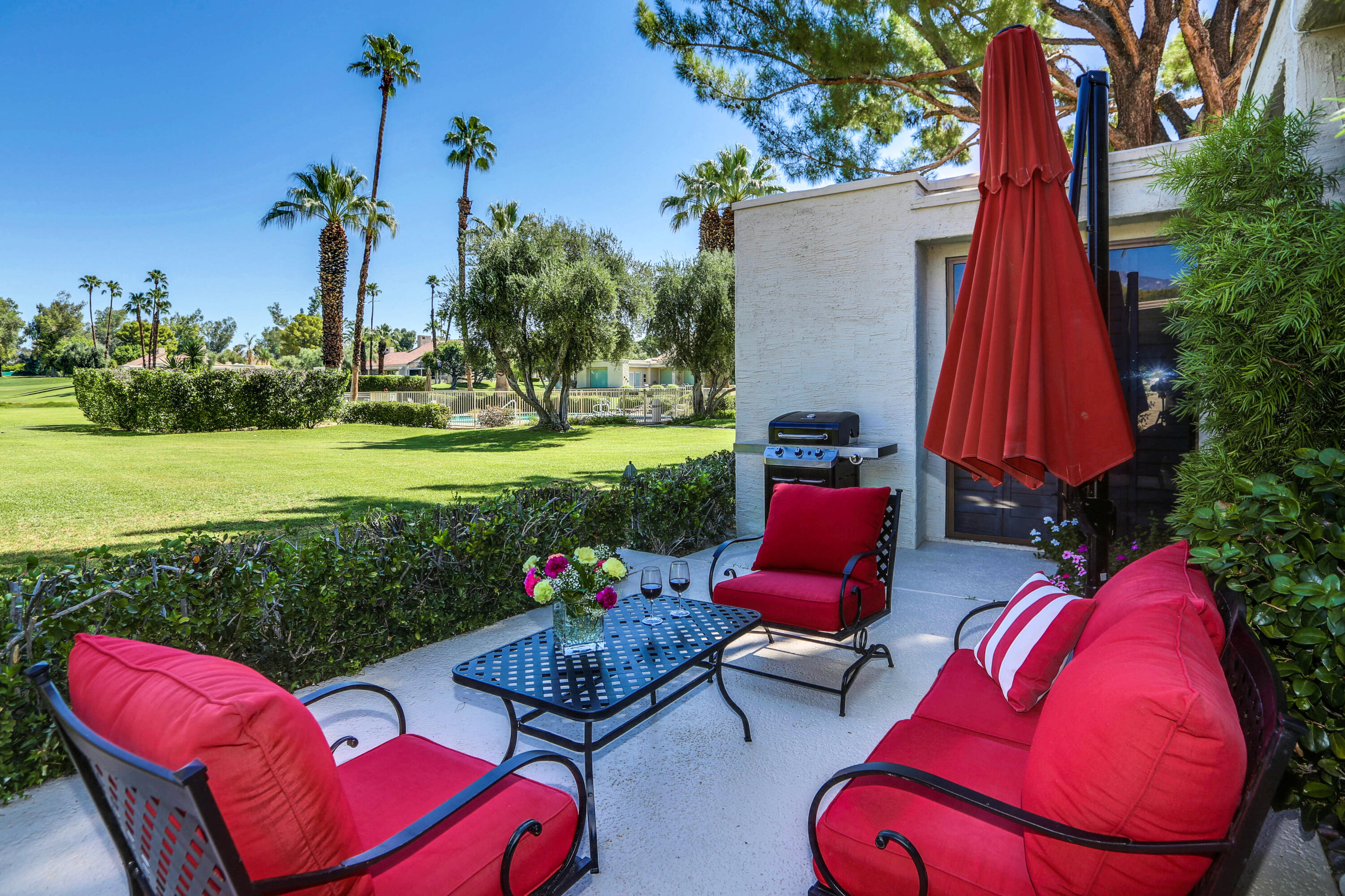 136 Desert W Drive Rancho Mirage, CA 92270 - Photo 33 of 46 a view of a chairs in backyard of the house