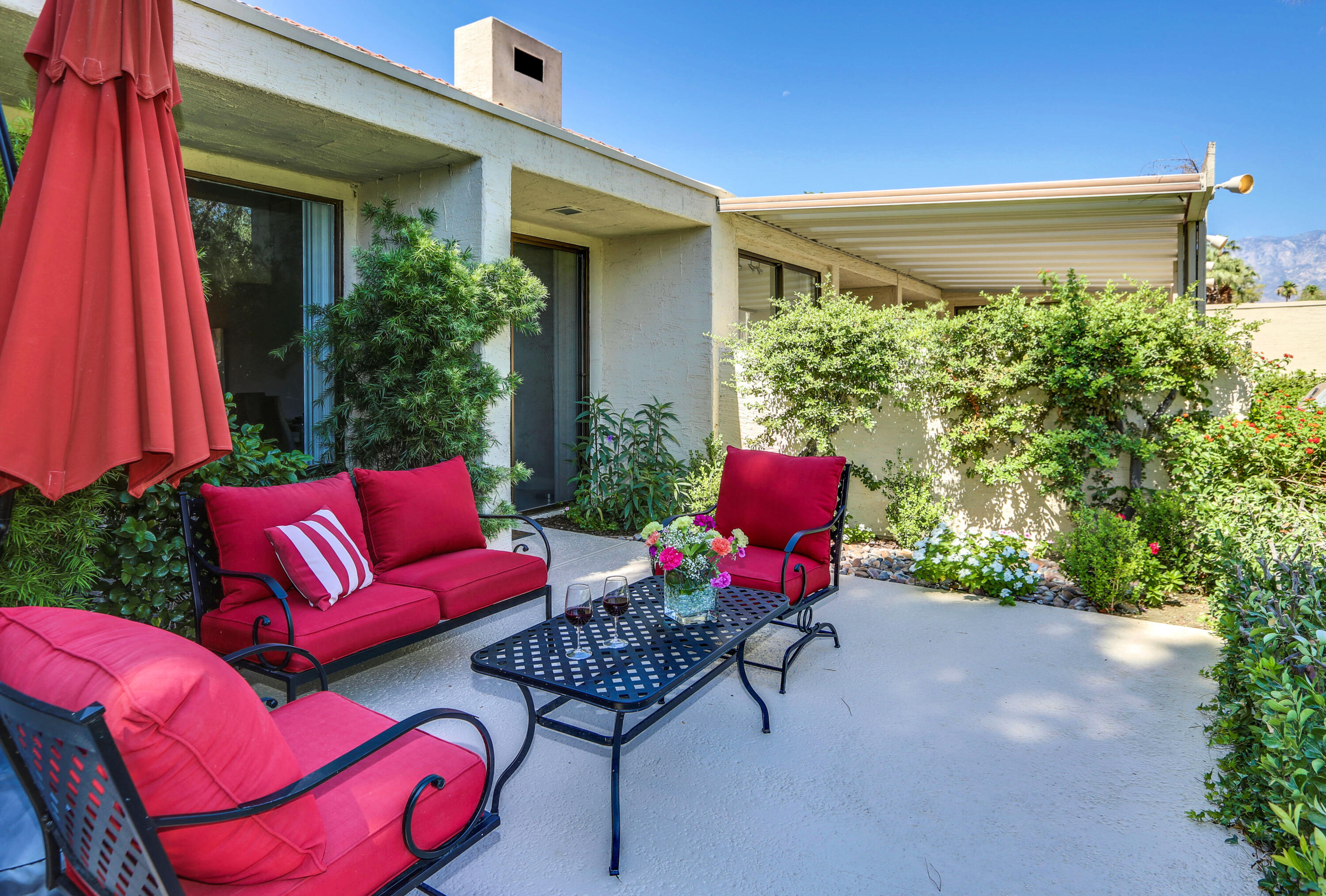 136 Desert W Drive Rancho Mirage, CA 92270 - Photo 35 of 46 a backyard of a house with outdoor seating