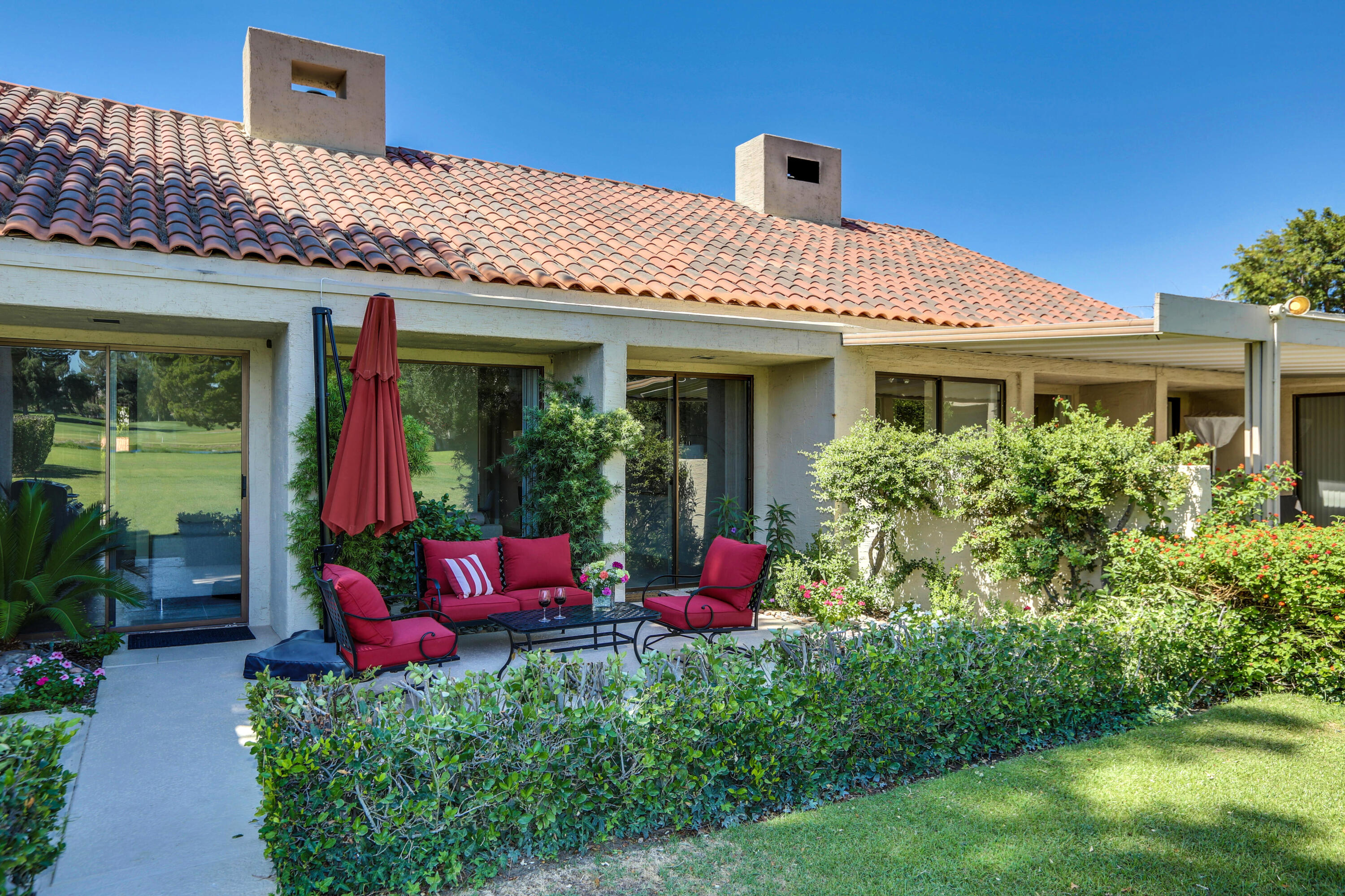136 Desert W Drive Rancho Mirage, CA 92270 - Photo 39 of 46 a view of a house with potted plants