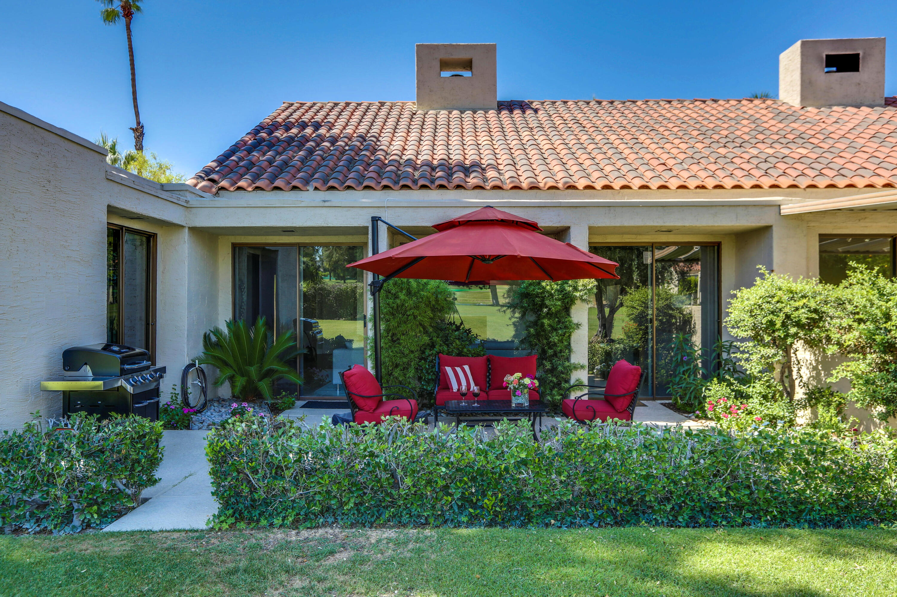 136 Desert W Drive Rancho Mirage, CA 92270 - Photo 40 of 46 a front view of a house with yard