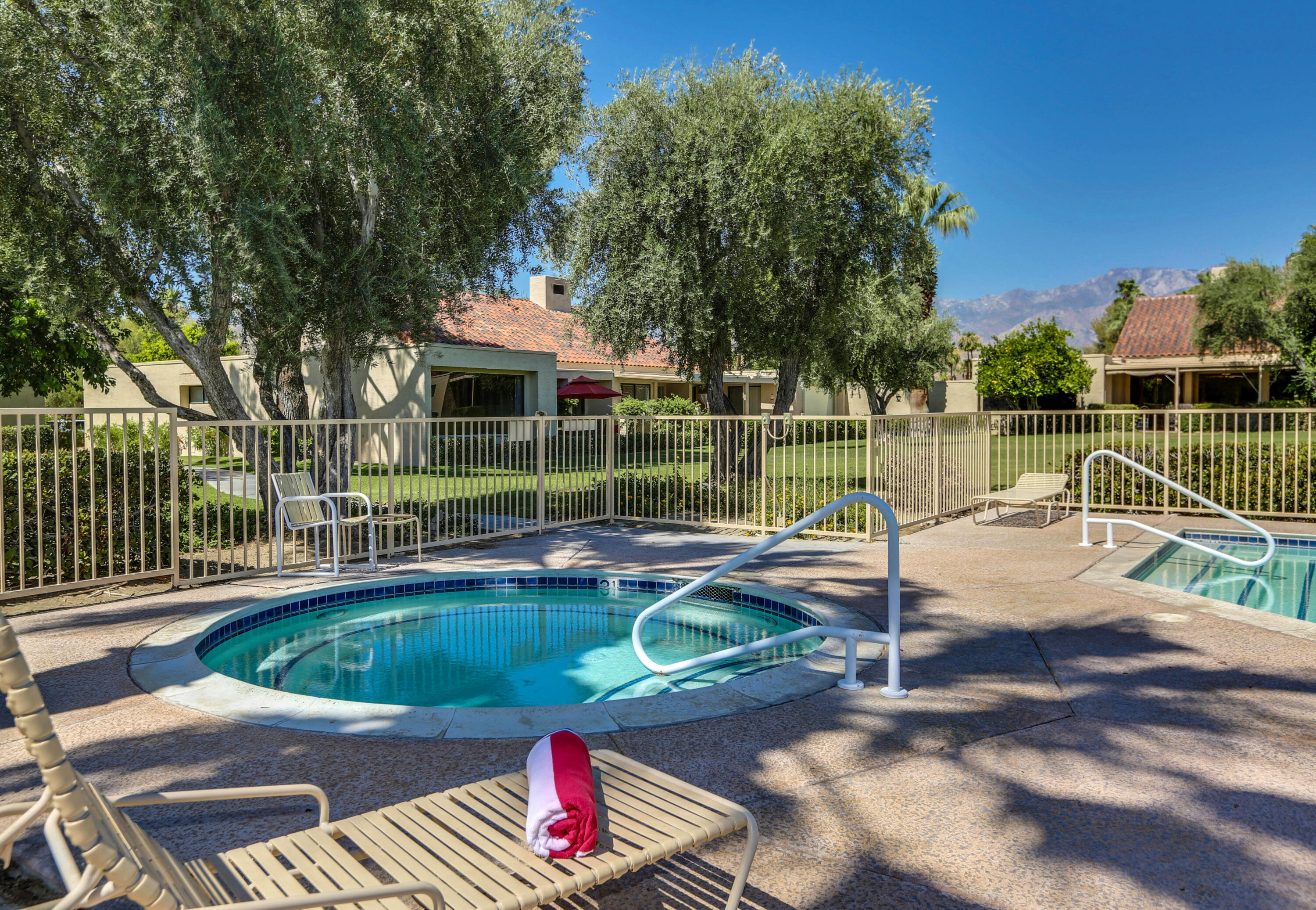 136 Desert W Drive Rancho Mirage, CA 92270 - Photo 43 of 46 a view of a swimming pool with a patio