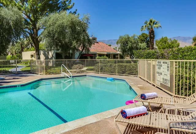 a view of a patio with swimming pool