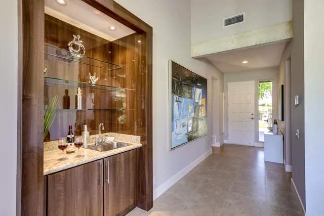 a bathroom with a double vanity sink and a mirror