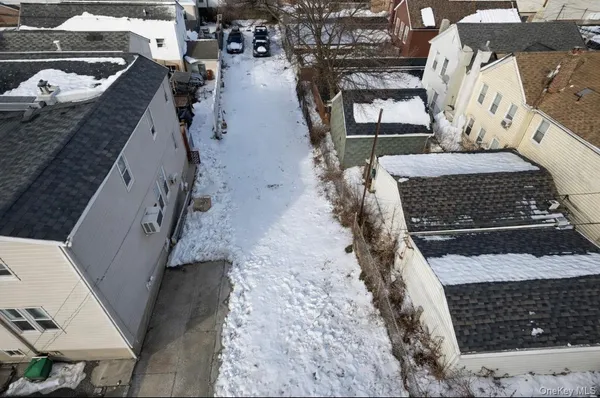 a view of a backyard with sitting area