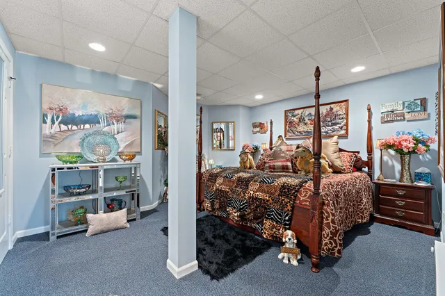 a bed room with furniture and window