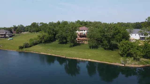 a view of a lake with a house in the background