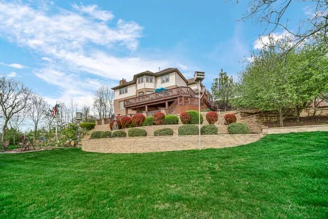 a view of a house with a backyard