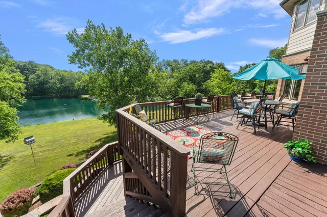 a view of balcony with furniture and garden