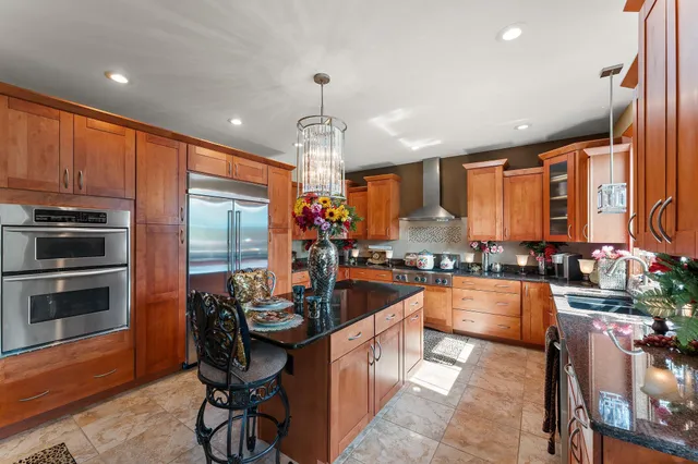 a kitchen with sink refrigerator and cabinets