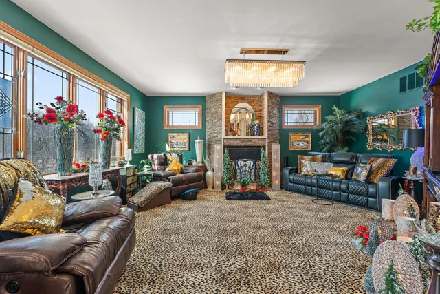 a living room with fireplace furniture and a flat screen tv