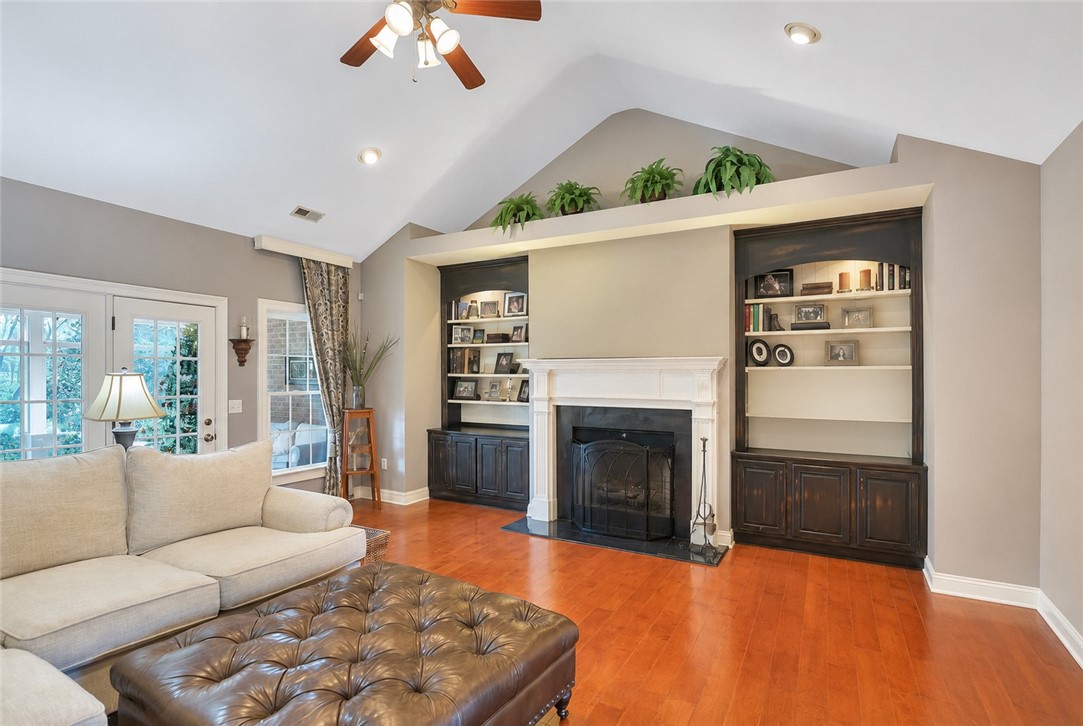 114 Augusta National Anderson, SC 29621 - Photo 45 of 47 A striking fireplace with custom built-ins anchors this inviting gathering space.