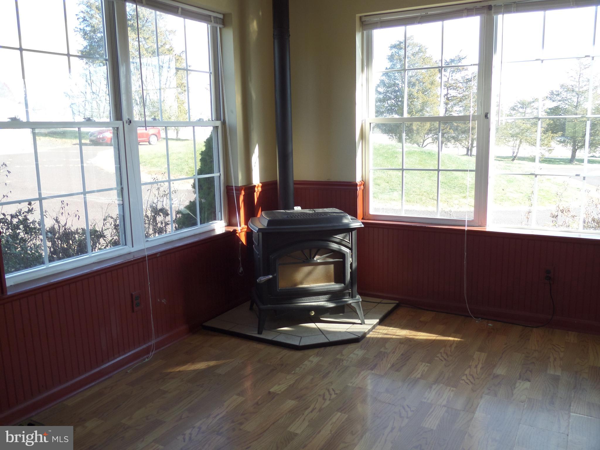 2969 Thompson Road Telford, PA 18969 - Photo 8 of 24 Wood burning stove in sunroom