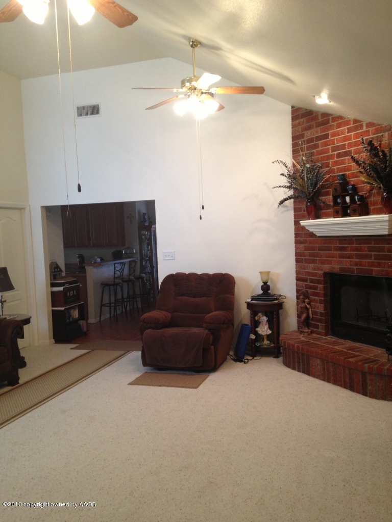 4801 Nimbus Lane Amarillo, TX 79110 - Photo 3 of 40 a living room with furniture and a fireplace