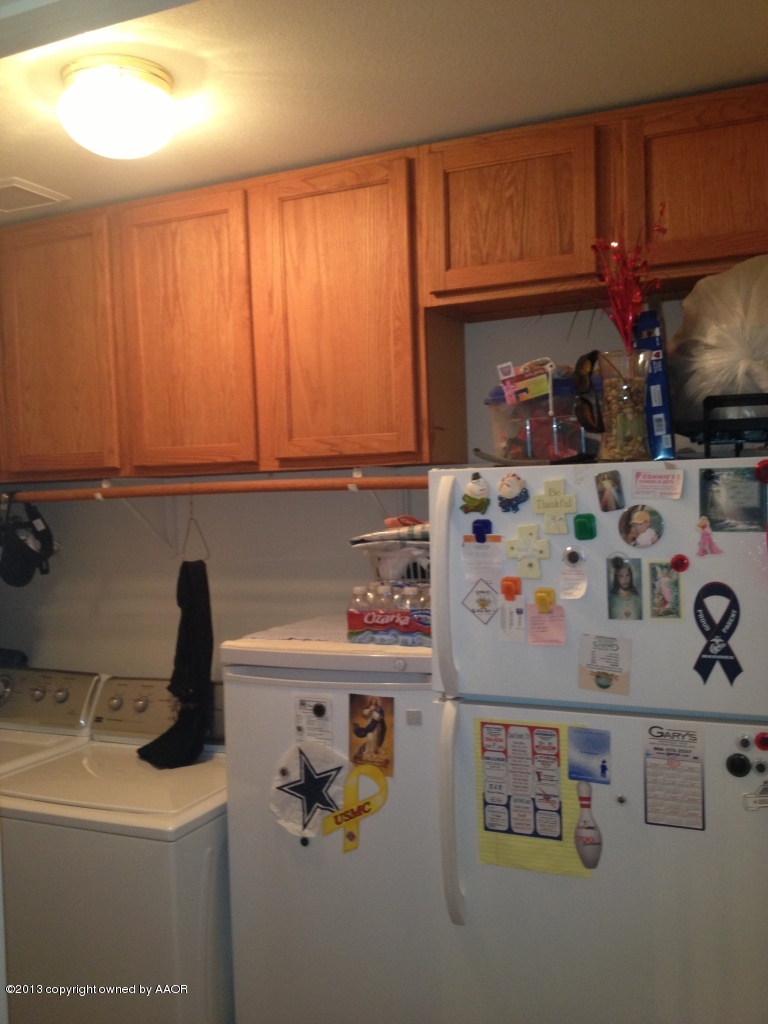 4801 Nimbus Lane Amarillo, TX 79110 - Photo 40 of 40 a kitchen with a refrigerator and a sink