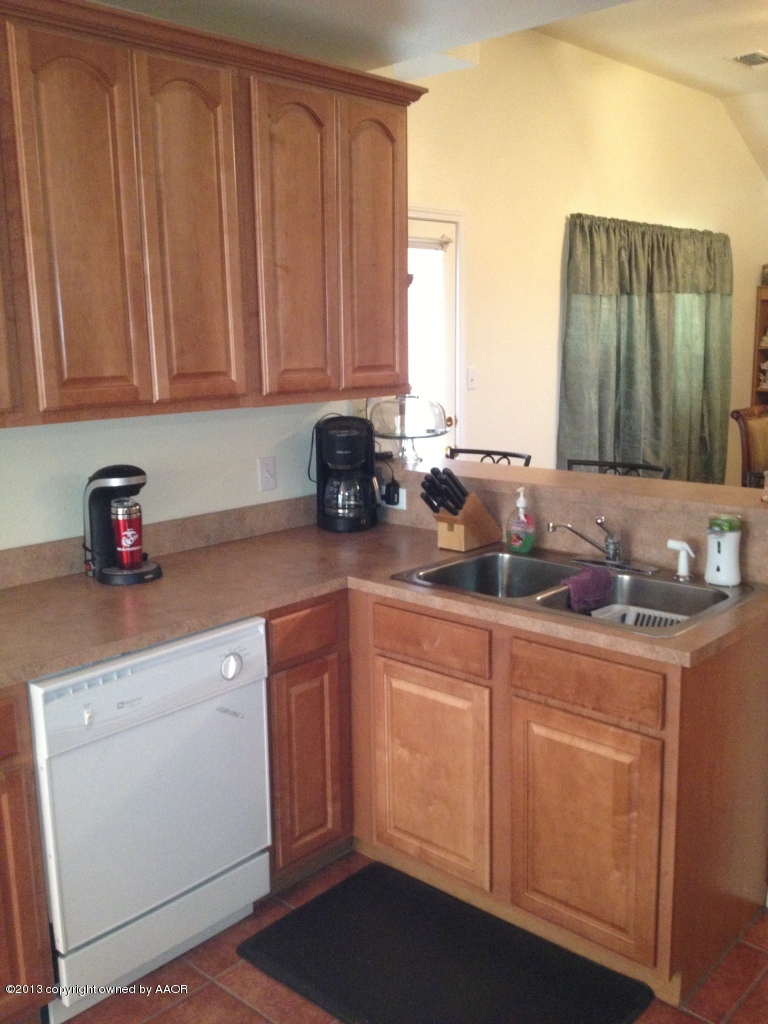 4801 Nimbus Lane Amarillo, TX 79110 - Photo 8 of 40 a kitchen with stainless steel appliances granite countertop a sink a stove and a microwave