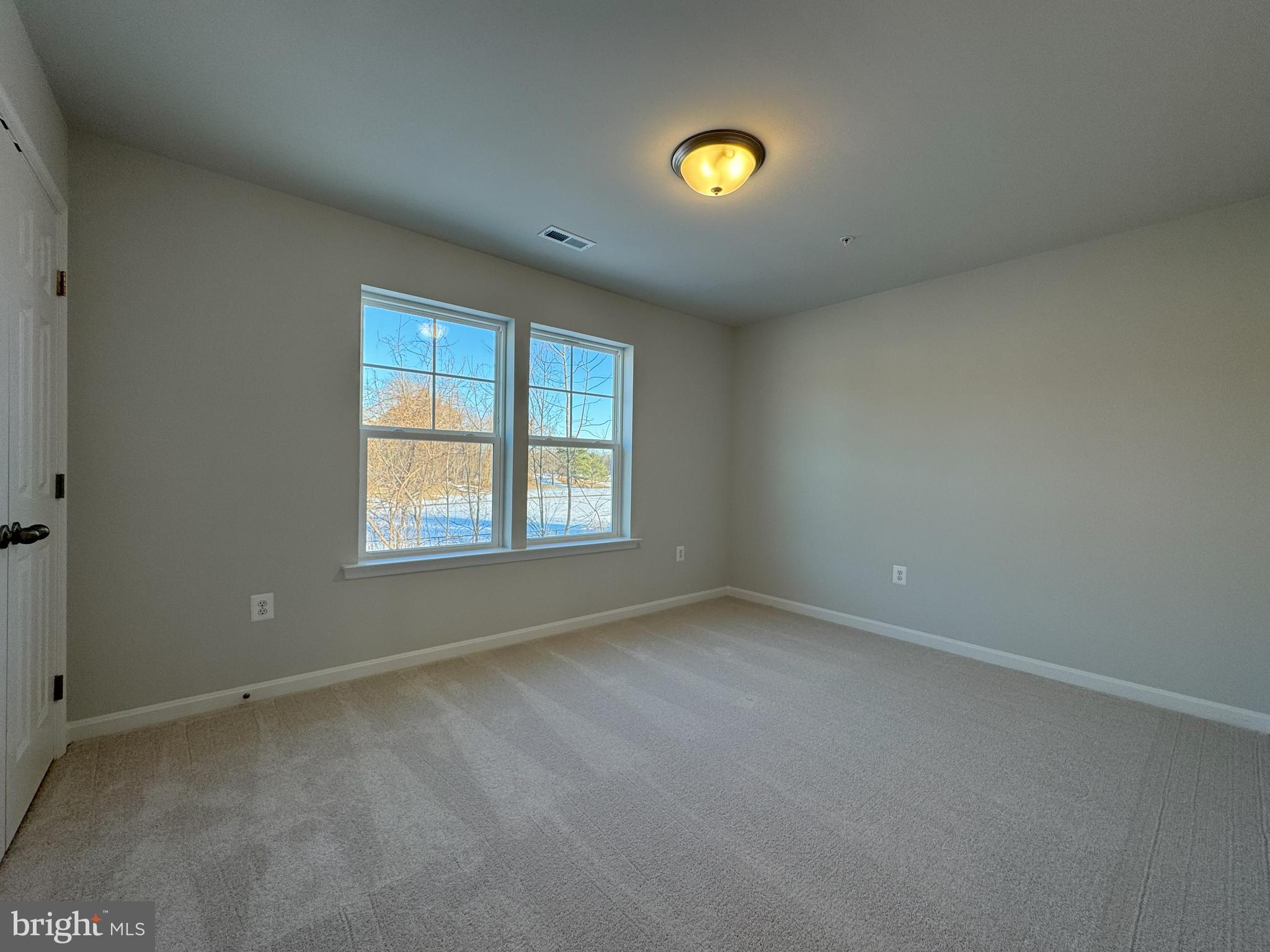 11306 H G Trueman Road Lusby, MD 20657 - Photo 19 of 33 an empty room with a window