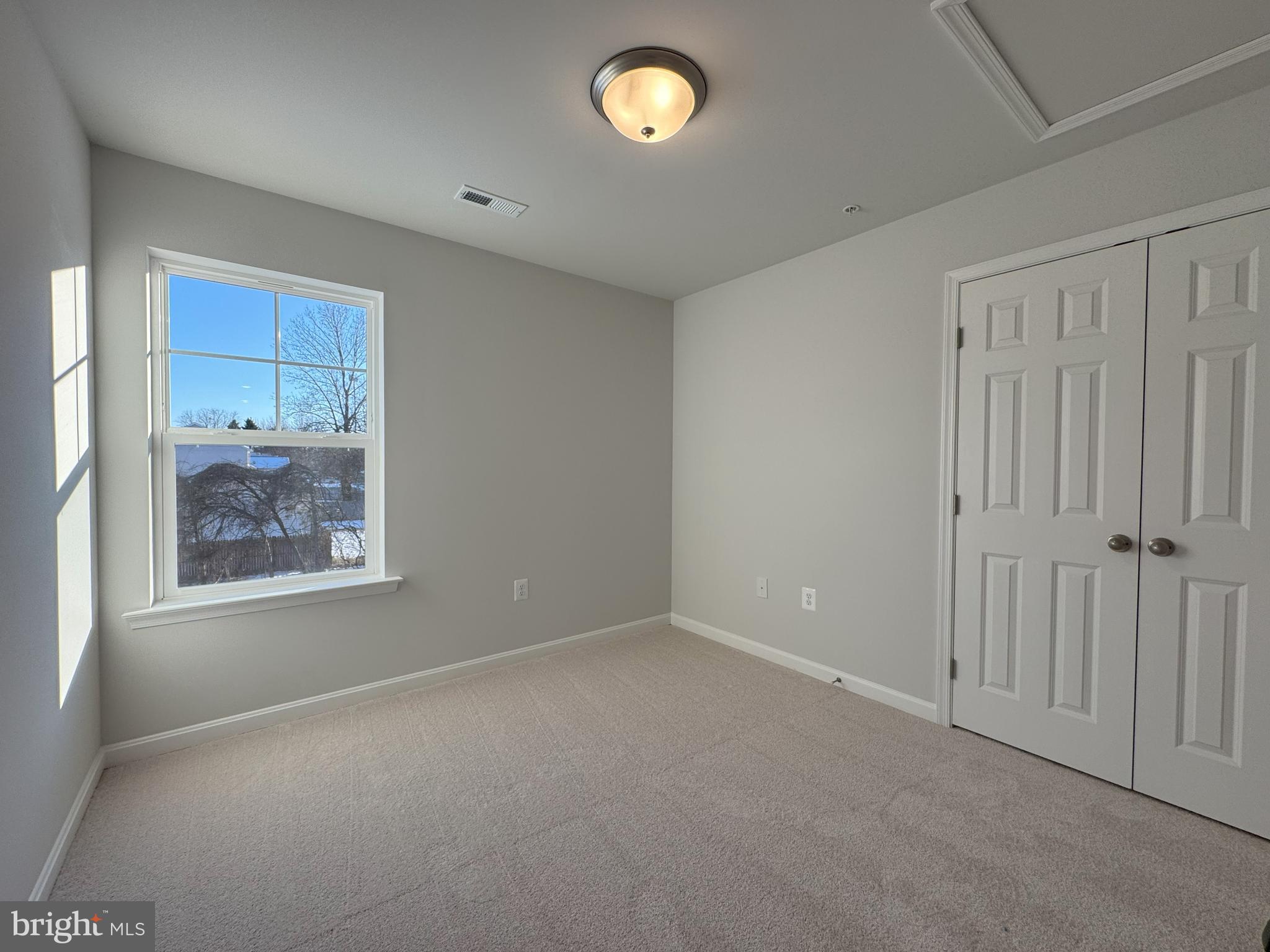 11306 H G Trueman Road Lusby, MD 20657 - Photo 20 of 33 a view of an empty room with a window