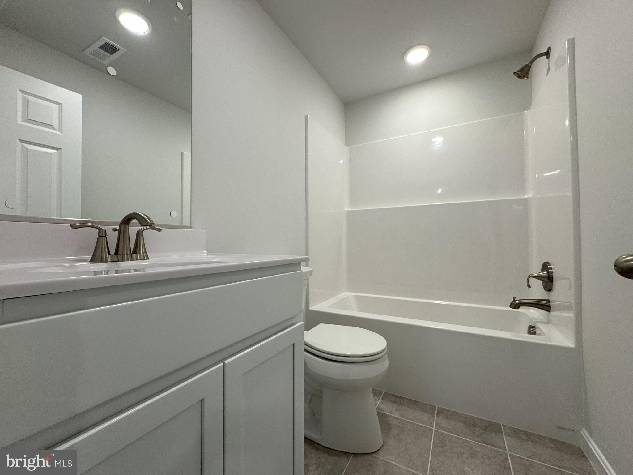 11306 H G Trueman Road Lusby, MD 20657 - Photo 26 of 33 a bathroom with a sink a toilet and shower