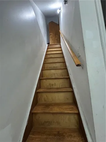 a living room with furniture a couch and a window