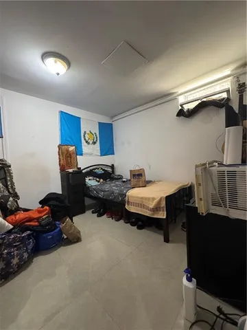 a bathroom with a toilet sink and shower