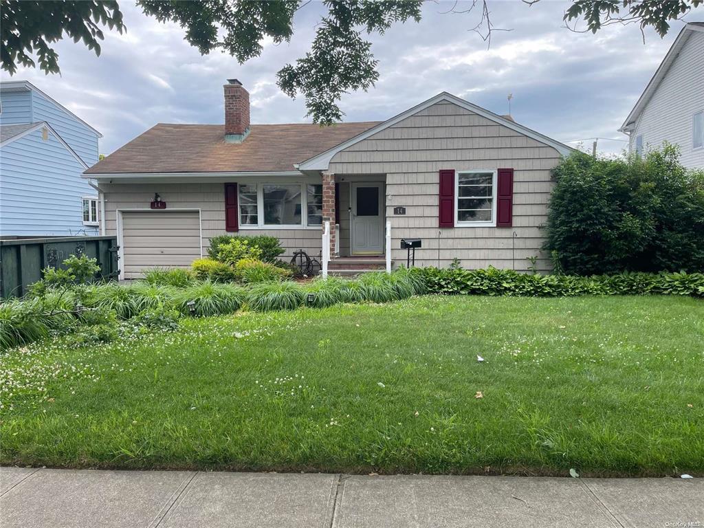 14 Heather Lane Plainview, NY 11803 - Photo 1 of 1 View of front of home with an attached garage, a chimney, and a front yard