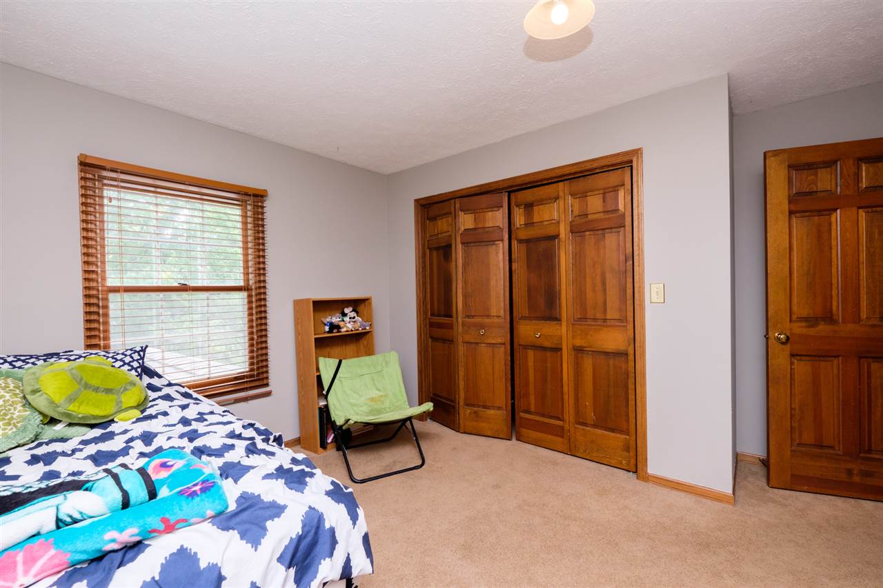 7097 Sentinel Road Rockford, IL 61107 - Photo 20 of 25 a bedroom with a bed and a window