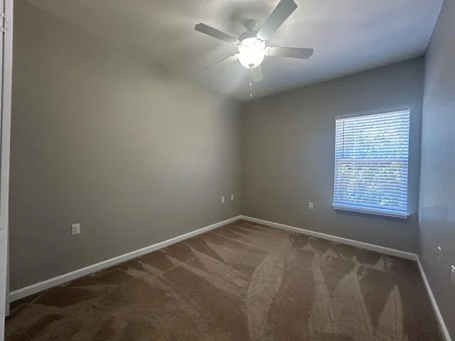 a view of hallway with natural light