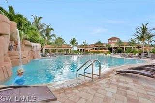 9522 Piacere Way Naples, FL 34113 - Photo 32 of 48 Community pool with a patio