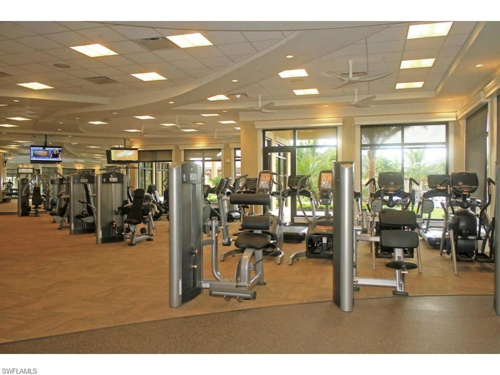 9522 Piacere Way Naples, FL 34113 - Photo 37 of 48 Exercise room with plenty of natural light and a paneled ceiling