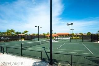 9522 Piacere Way Naples, FL 34113 - Photo 38 of 48 View of tennis court with fence