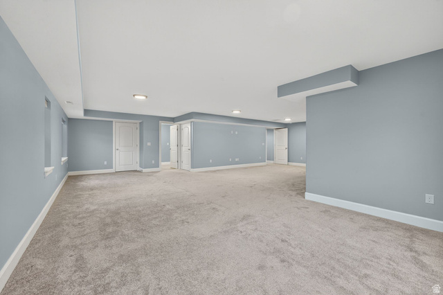1222 West 190th Street North Mapleton, UT 84664 - Photo 34 of 46 Spacious room featuring light blue walls, white trim, recessed lighting, and grey carpeting