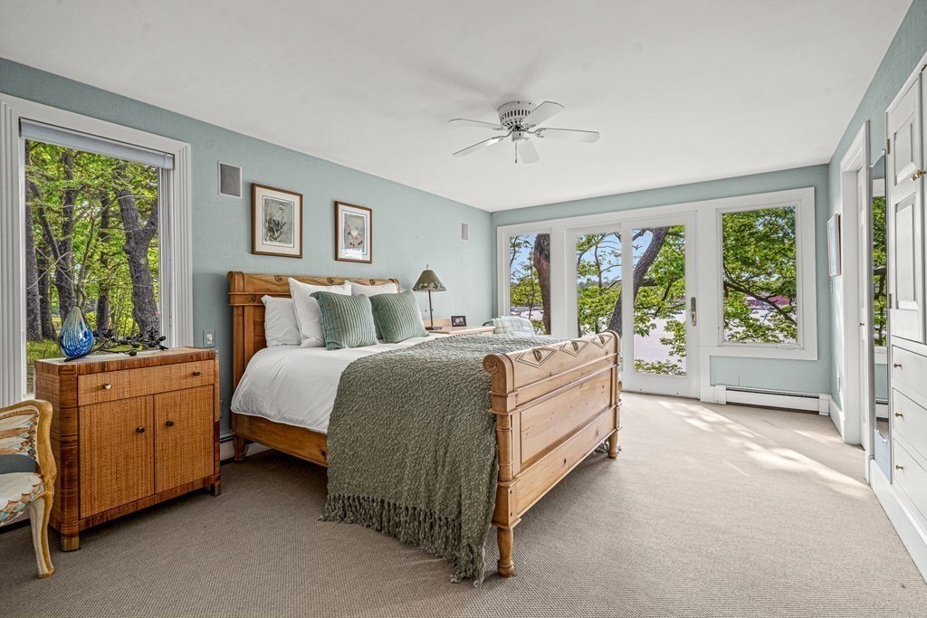 9 Proctor Street Manchester, MA 01944 - Photo 25 of 42 a spacious bedroom with a bed and a dresser
