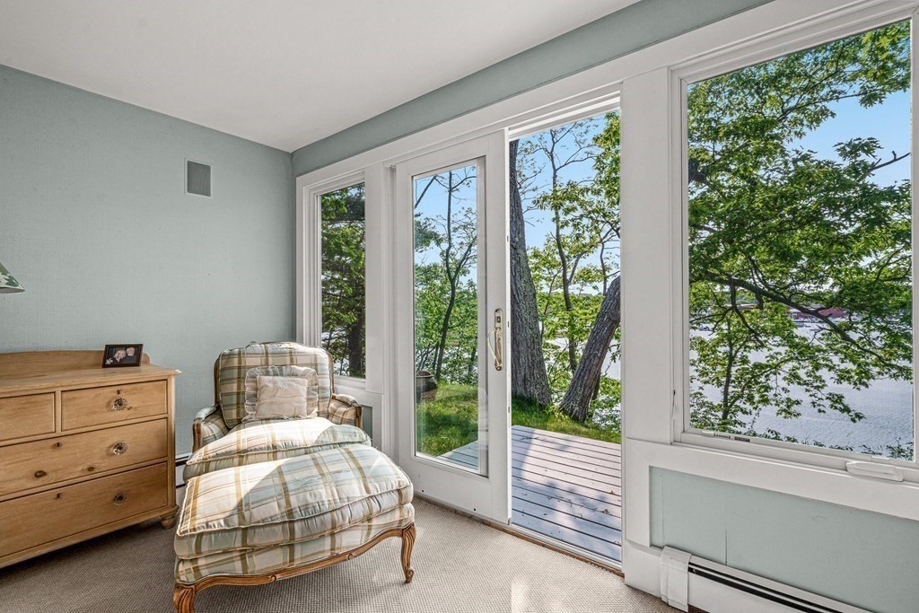 9 Proctor Street Manchester, MA 01944 - Photo 27 of 42 a spacious bedroom with a bed and a window