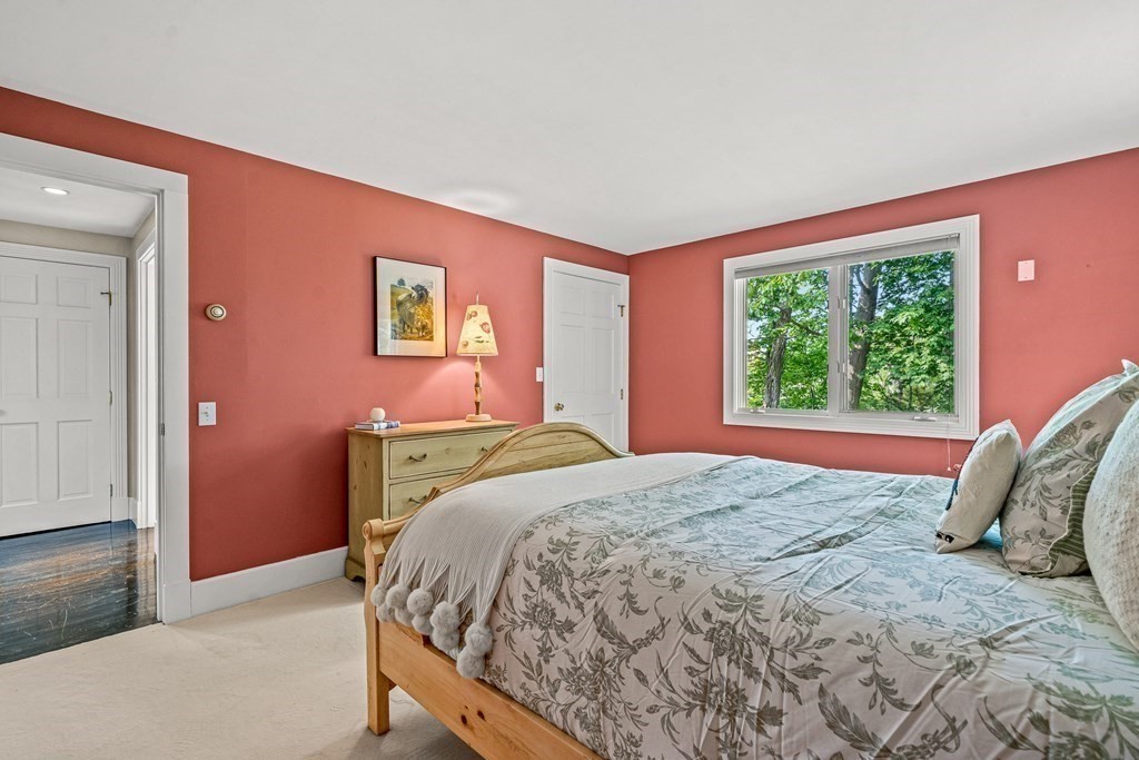 9 Proctor Street Manchester, MA 01944 - Photo 31 of 42 a bedroom with a bed and a large window