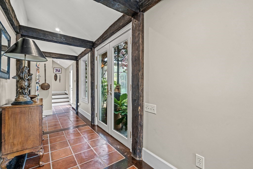 9 Proctor Street Manchester, MA 01944 - Photo 33 of 42 a hallway with wooden floor and glass door