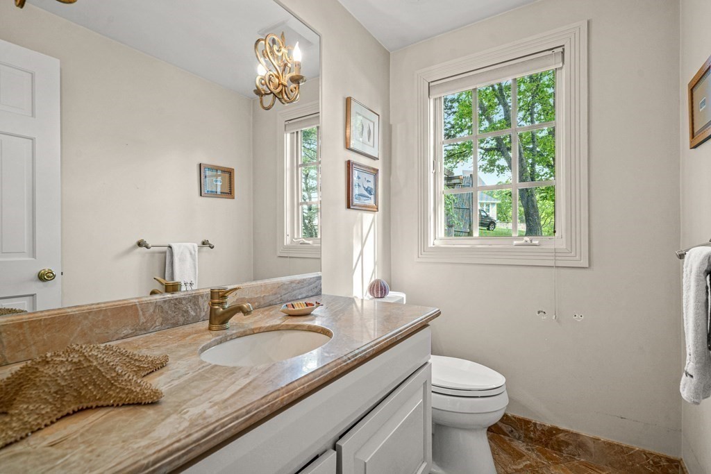9 Proctor Street Manchester, MA 01944 - Photo 34 of 42 a bathroom with a granite countertop sink and a toilet