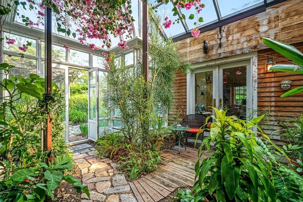 9 Proctor Street Manchester, MA 01944 - Photo 5 of 42 a view of a garden with sitting area