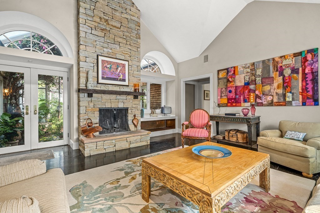 9 Proctor Street Manchester, MA 01944 - Photo 8 of 42 a living room with furniture a flat screen tv and a fireplace