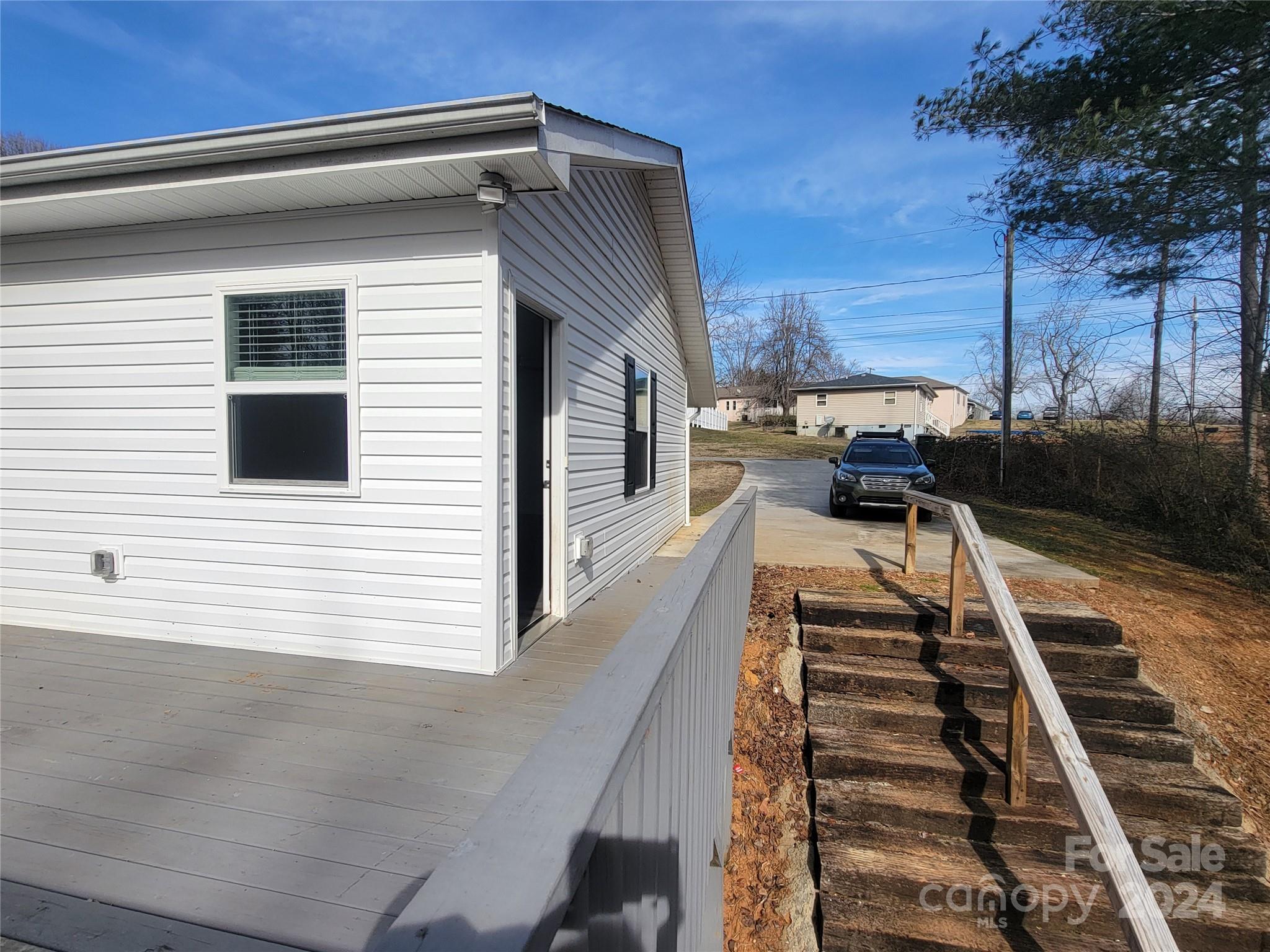 636 Hawthorne Street Hudson, NC 28638 - Photo 18 of 21 a view of a balcony with wooden floor and fence